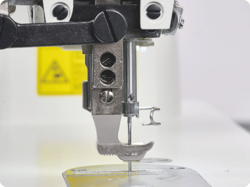 Mid-sewing presser foot height adjustment eliminates manual lifting
